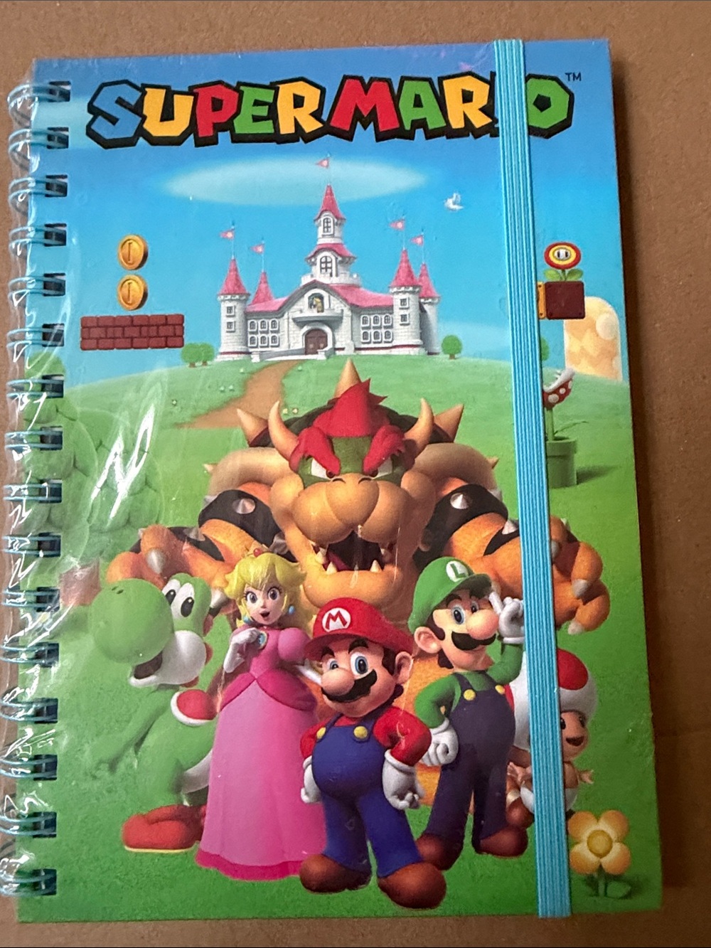 Super Mario Spiral Notebook with Elastic - Blue. Collectible.